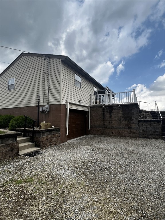 516 Chestnut Ridge Rd, Amwell, PA 15301 - view of side of home with gravel driveway and a garage