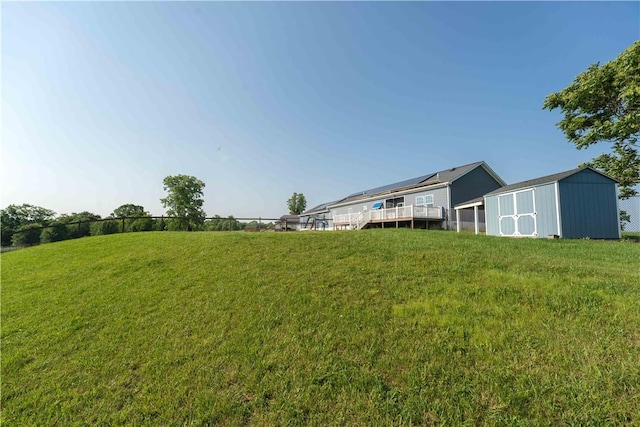 140 Jocelynn Ln, Smithfield, PA 15478 - view of green lawn featuring a storage unit and a deck