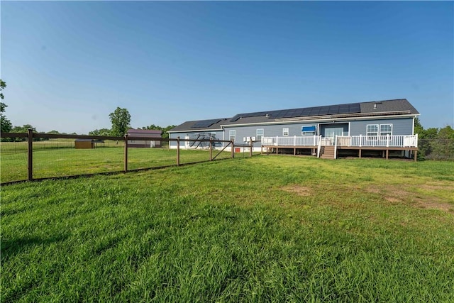 140 Jocelynn Ln, Smithfield, PA 15478 - back of property with a wooden deck and roof mounted solar panels