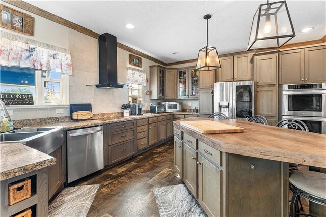 140 Jocelynn Ln, Smithfield, PA 15478 - kitchen featuring wall chimney exhaust hood, appliances with stainless steel finishes, ornamental molding, dark wood-style flooring, and a breakfast bar area