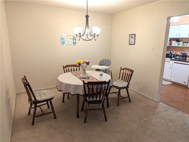 2120 Greentree Rd Unit 309E, Pittsburgh, PA 15220 - dining room featuring a chandelier and light colored carpet