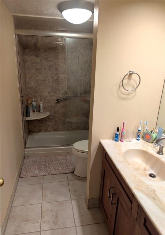 2120 Greentree Rd Unit 309E, Pittsburgh, PA 15220 - full bathroom with vanity, a stall shower, and tile patterned flooring