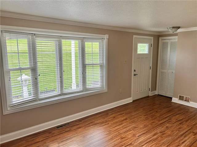 71 Armstrong Dr, Canton Twp, PA 15301 - entryway with wood finished floors, a textured ceiling, and ornamental molding