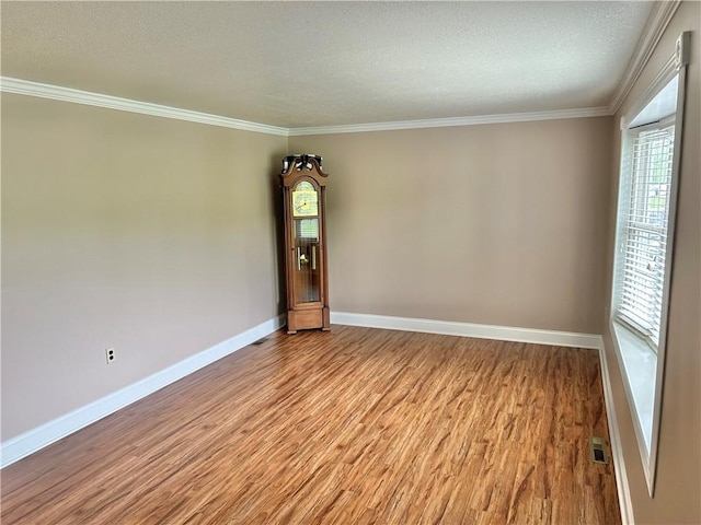71 Armstrong Dr, Canton Twp, PA 15301 - unfurnished room with light wood-type flooring, a textured ceiling, and ornamental molding