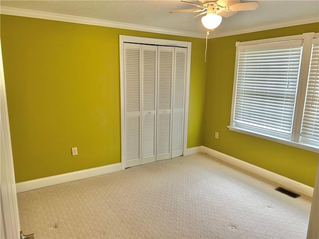 71 Armstrong Dr, Canton Twp, PA 15301 - unfurnished bedroom with carpet floors, a closet, ornamental molding, and a ceiling fan