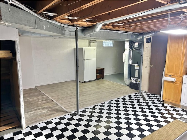 71 Armstrong Dr, Canton Twp, PA 15301 - below grade area featuring freestanding refrigerator, tile patterned floors, and heating unit