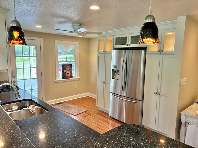 71 Armstrong Dr, Canton Twp, PA 15301 - kitchen with stainless steel refrigerator with ice dispenser, light wood-type flooring, a textured ceiling, ceiling fan, and decorative light fixtures