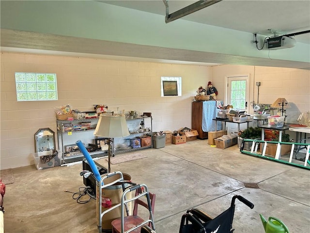 71 Armstrong Dr, Canton Twp, PA 15301 - garage featuring a garage door opener and concrete block wall