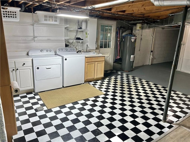 71 Armstrong Dr, Canton Twp, PA 15301 - unfinished below grade area with electric water heater, washing machine and clothes dryer, and light floors