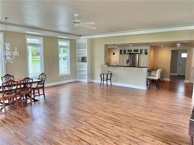71 Armstrong Dr, Canton Twp, PA 15301 - living area featuring ceiling fan, light wood-type flooring, and crown molding