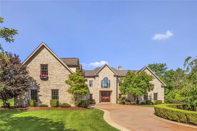 7023 Fair Oaks Dr, Export, PA 15632 - view of front of house with a front lawn, a chimney, and brick siding