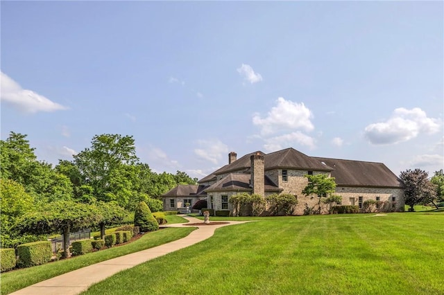 7023 Fair Oaks Dr, Export, PA 15632 - back of property with a lawn and a chimney