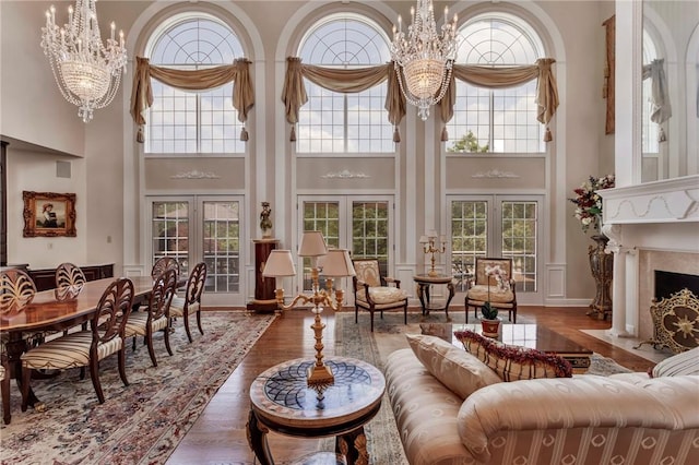 7023 Fair Oaks Dr, Export, PA 15632 - living area with a towering ceiling, french doors, healthy amount of natural light, and a chandelier