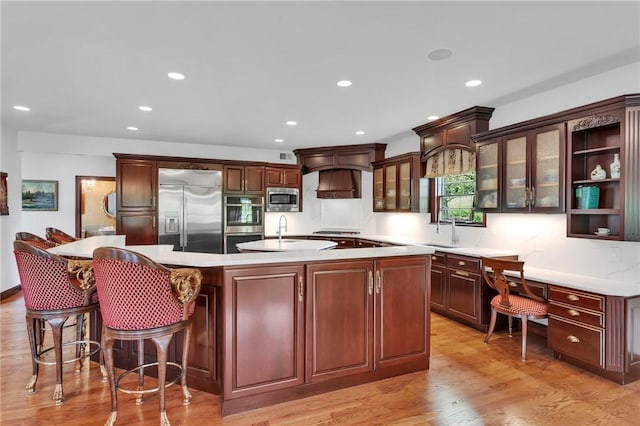 7023 Fair Oaks Dr, Export, PA 15632 - kitchen with built in appliances, a large island, light wood-style floors, recessed lighting, and light countertops