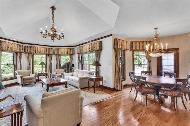 7023 Fair Oaks Dr, Export, PA 15632 - living room featuring a chandelier, wood finished floors, and healthy amount of natural light
