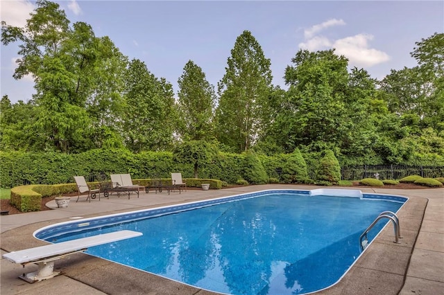 7023 Fair Oaks Dr, Export, PA 15632 - view of pool featuring a diving board, a patio area, and view of scattered trees