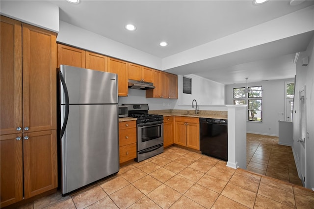 47 S 16th St, South Side, PA 15203 - kitchen featuring appliances with stainless steel finishes, under cabinet range hood, a peninsula, light countertops, and light tile patterned floors