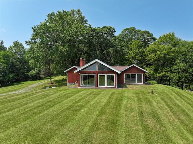 117 Stoneys Ln, Lehigh Twp, PA 16063 - rear view of house with a chimney and a lawn
