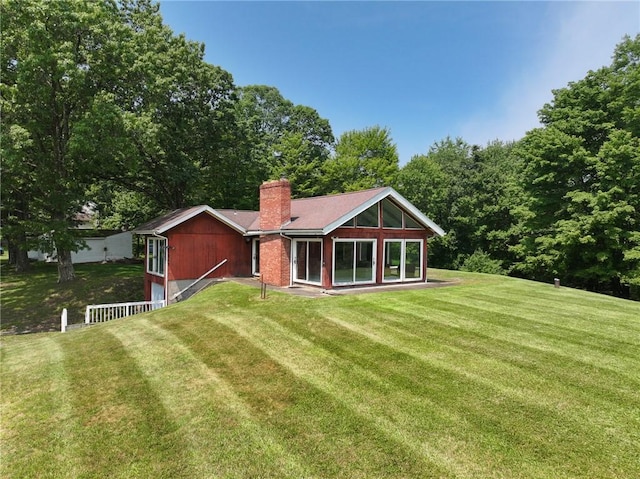 117 Stoneys Ln, Lehigh Twp, PA 16063 - back of house featuring a yard and a chimney