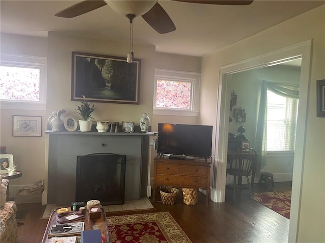 766 6th St, Beaver, PA 15009 - living room featuring a ceiling fan, light wood finished floors, and a fireplace with flush hearth
