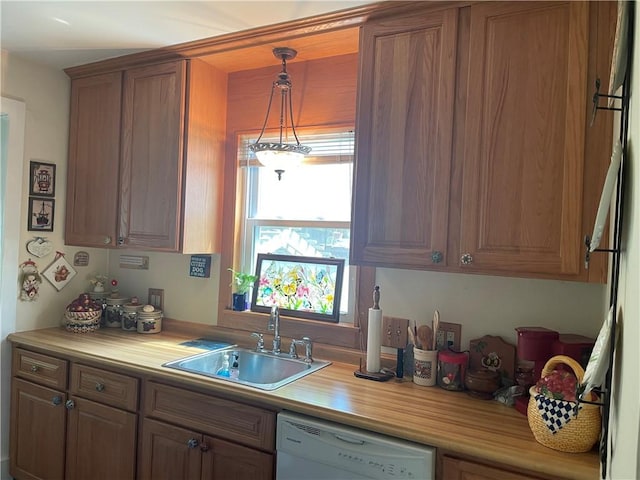 766 6th St, Beaver, PA 15009 - kitchen with dishwasher, light countertops, brown cabinets, and pendant lighting