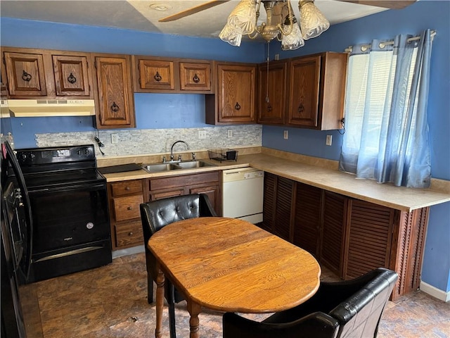 99 Mckean Ave, Donora, PA 15033 - kitchen featuring dishwasher, under cabinet range hood, black electric range oven, brown cabinets, and light countertops