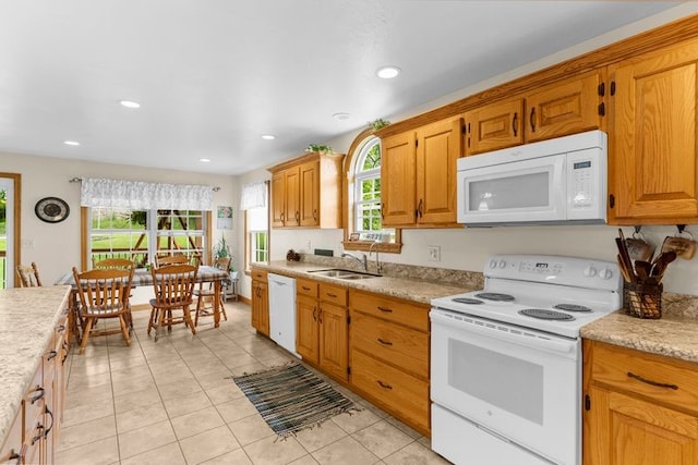 840 Sunol Rd, Deer Creek, PA 16314 - kitchen featuring white appliances, light tile patterned floors, recessed lighting, and brown cabinets