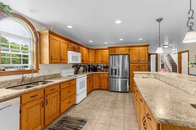 840 Sunol Rd, Deer Creek, PA 16314 - kitchen featuring white appliances, brown cabinetry, light tile patterned floors, light stone countertops, and recessed lighting