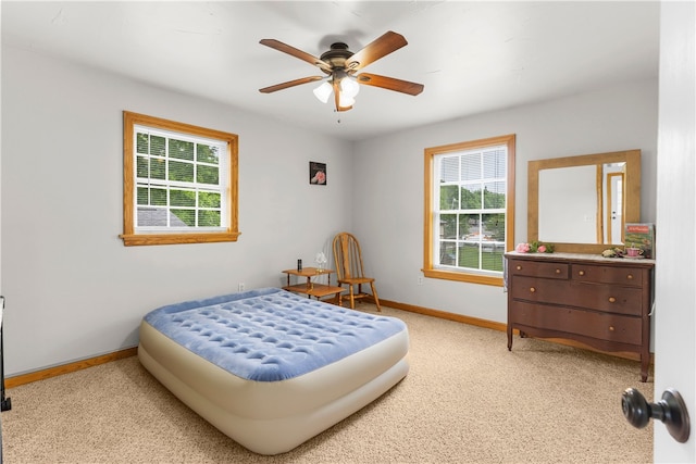 840 Sunol Rd, Deer Creek, PA 16314 - bedroom featuring multiple windows, light colored carpet, and ceiling fan