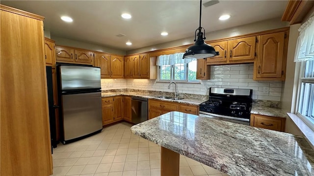 2231 Dellenbaugh Rd, Frazer, PA 15084 - kitchen featuring appliances with stainless steel finishes, brown cabinets, light tile patterned floors, and recessed lighting