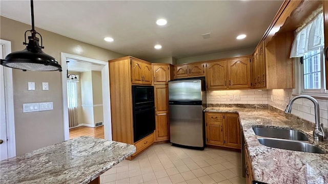 2231 Dellenbaugh Rd, Frazer, PA 15084 - kitchen featuring black appliances, backsplash, light stone countertops, brown cabinets, and recessed lighting