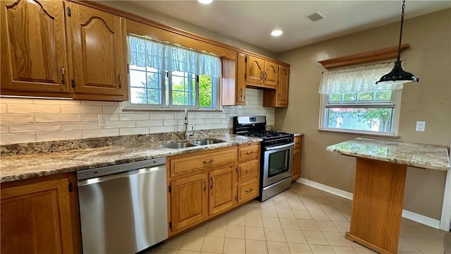 2231 Dellenbaugh Rd, Frazer, PA 15084 - kitchen with appliances with stainless steel finishes, brown cabinetry, tasteful backsplash, plenty of natural light, and recessed lighting