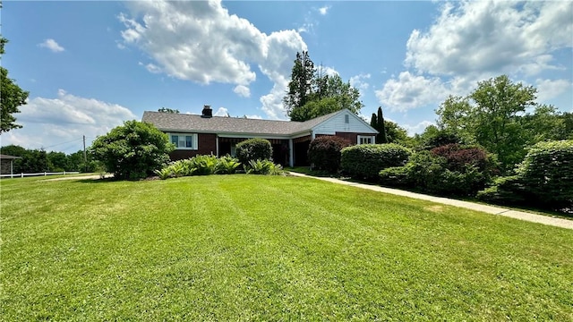 2231 Dellenbaugh Rd, Frazer, PA 15084 - ranch-style house with a front lawn, a chimney, and brick siding