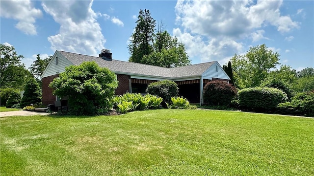 2231 Dellenbaugh Rd, Frazer, PA 15084 - view of home's exterior with a yard, a chimney, and brick siding