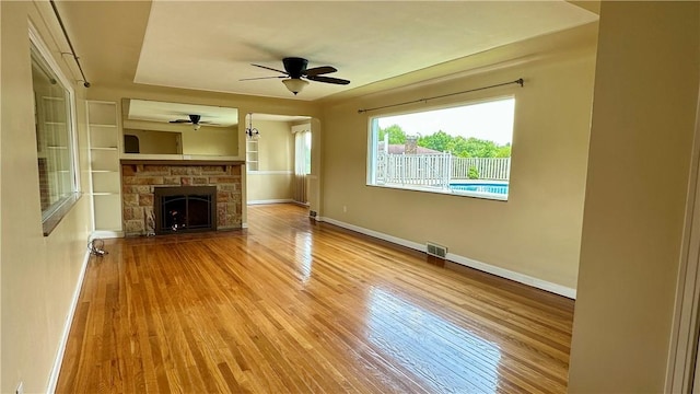 2231 Dellenbaugh Rd, Frazer, PA 15084 - unfurnished living room featuring wood finished floors, a ceiling fan, and a fireplace