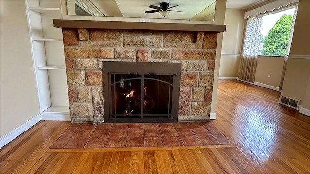 2231 Dellenbaugh Rd, Frazer, PA 15084 - detailed view of wood finished floors, ceiling fan, and a lit fireplace