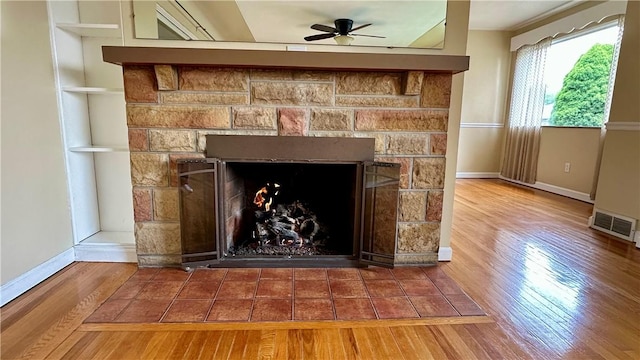2231 Dellenbaugh Rd, Frazer, PA 15084 - detailed view of wood finished floors, ceiling fan, and a fireplace with flush hearth