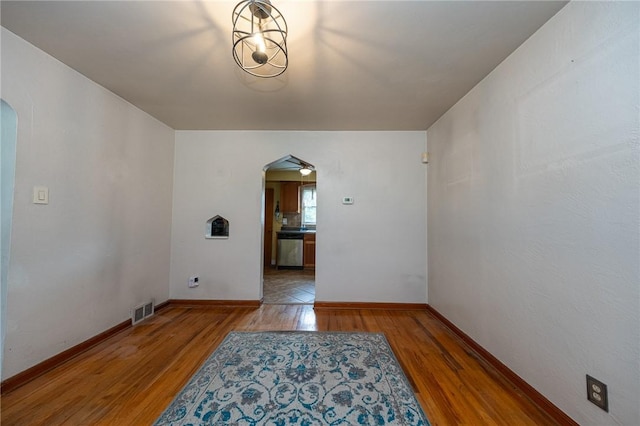 3037 Churchview, Baldwin Boro, PA 15227 - spare room featuring arched walkways and wood finished floors