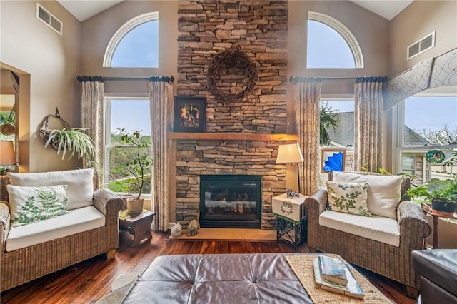 74 Quail Run, Unity Twp, PA 15601 - living area featuring a towering ceiling, plenty of natural light, wood finished floors, and a fireplace