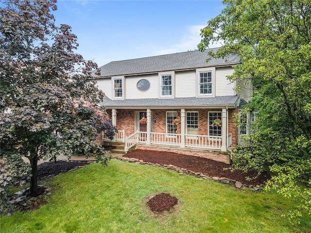 403 Lundy Ct, Cranberry Twp, PA 16066 - traditional-style home with brick siding, a front yard, a porch, and a shingled roof