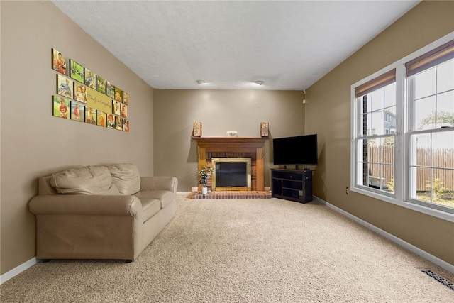 403 Lundy Ct, Cranberry Twp, PA 16066 - carpeted living room featuring healthy amount of natural light, a fireplace, and a textured ceiling