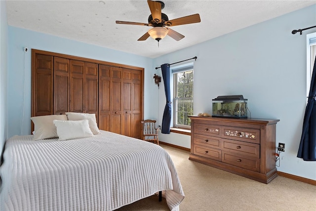 403 Lundy Ct, Cranberry Twp, PA 16066 - bedroom featuring light colored carpet, a closet, and ceiling fan