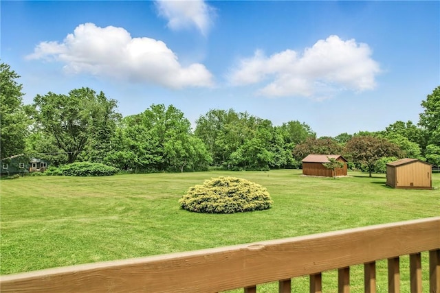 816 Wheatland Rd, Shenango Twp Mer, PA 16159 - view of green lawn featuring a storage shed and view of scattered trees
