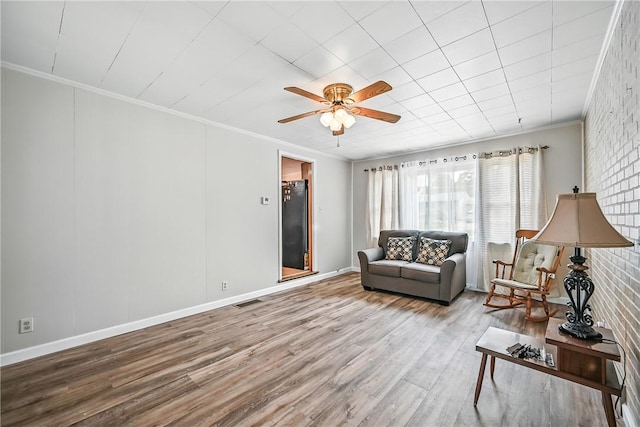 816 Wheatland Rd, Shenango Twp Mer, PA 16159 - living area with ornamental molding, wood finished floors, and a ceiling fan