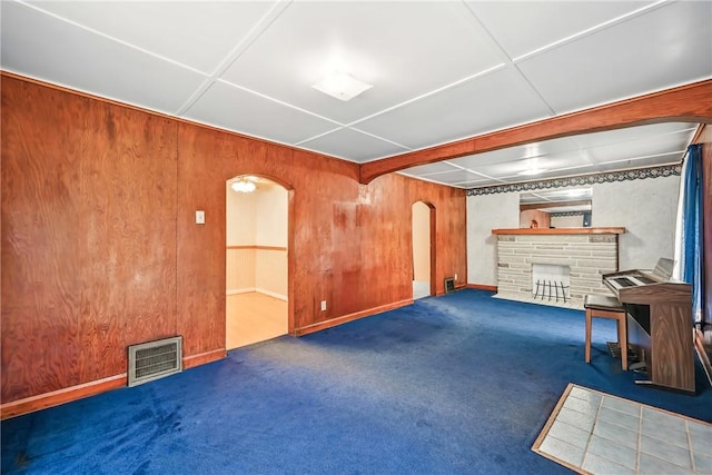 816 Wheatland Rd, Shenango Twp Mer, PA 16159 - basement with arched walkways, a stone fireplace, wooden walls, and carpet flooring