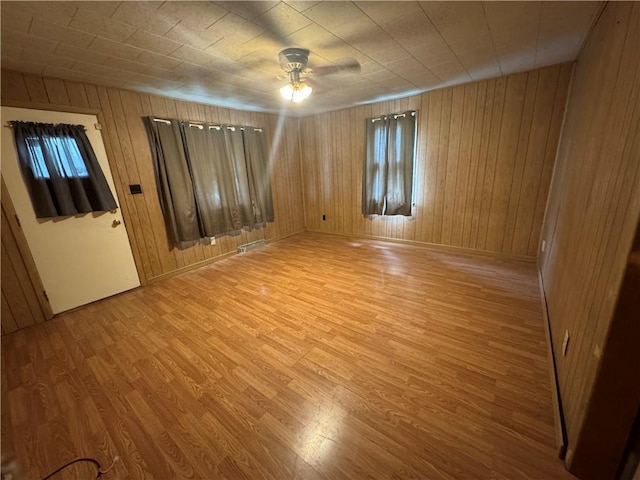2193 Springhill Furnace Rd, Springhill Twp, PA 15478 - unfurnished room with a ceiling fan, light wood-style floors, and wooden walls