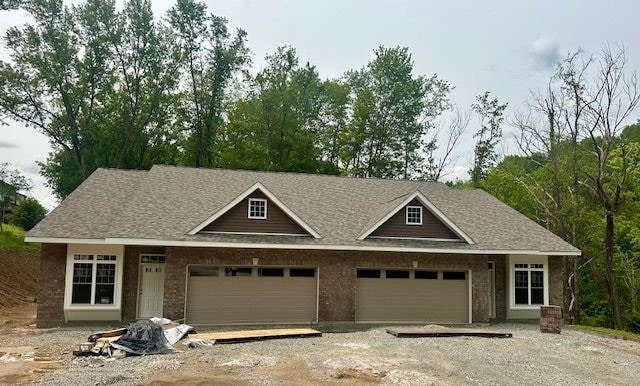 4055 Briarwood Dr, Hempfield Twp Wml, PA 15644 - view of front of house with driveway, an attached garage, roof with shingles, and brick siding