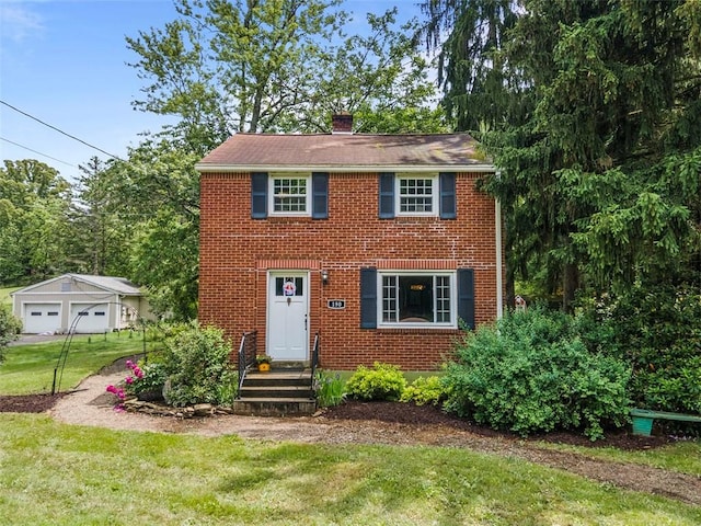 190 Wexford Bayne, Pine Twp Nal, PA 15090 - colonial house with a chimney, a front yard, a detached garage, and brick siding