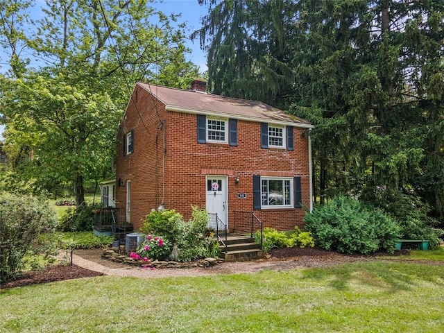 190 Wexford Bayne, Pine Twp Nal, PA 15090 - colonial home with a front lawn, a chimney, and brick siding