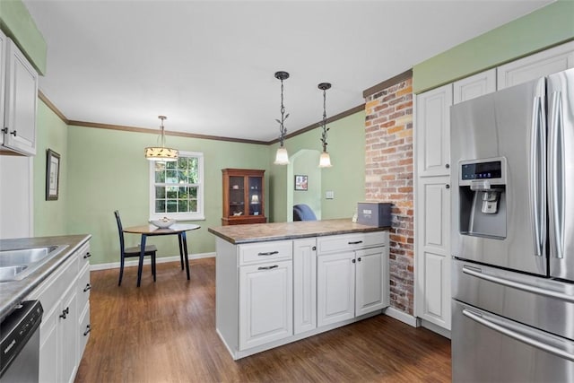 190 Wexford Bayne, Pine Twp Nal, PA 15090 - kitchen featuring appliances with stainless steel finishes, a peninsula, white cabinetry, dark wood-style floors, and ornamental molding